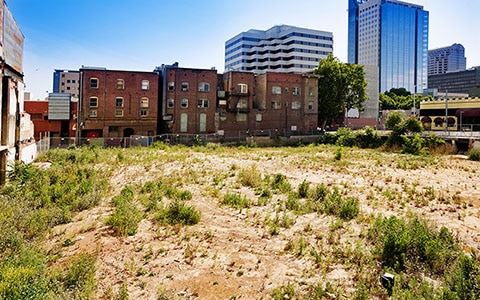 vacant lot next to apartment building